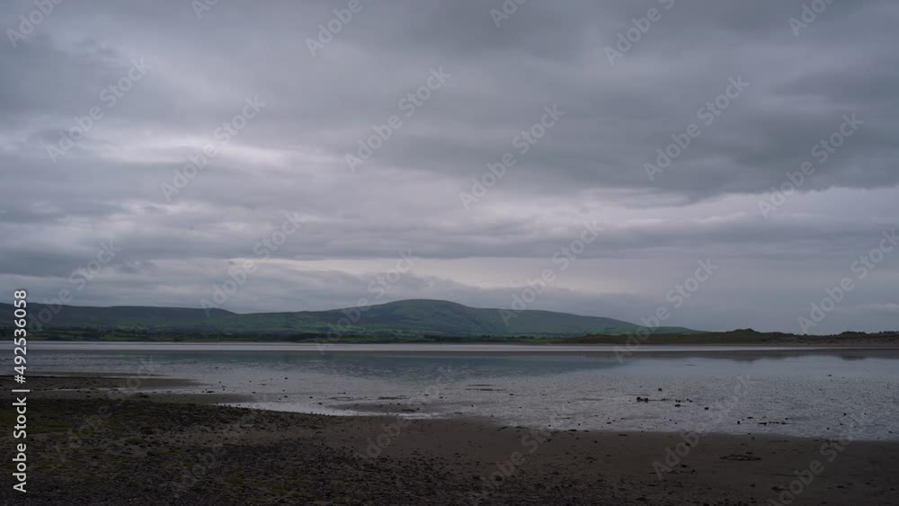 Clouds passing over seaside view low tide Timelapse Clouds passing over seaside view low tide Timelapse