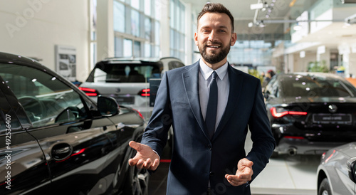 Cuadro en lienzo charismatic respectable car dealership owner greets new customers in the showroo