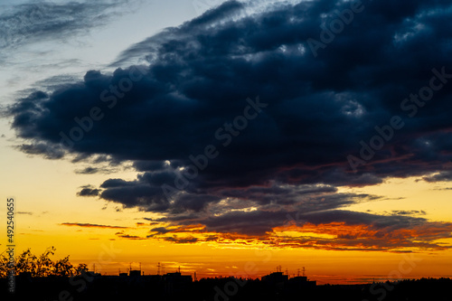 Fototapeta Naklejka Na Ścianę i Meble -  dramatic summer evening orange sky, bright colorful sunset