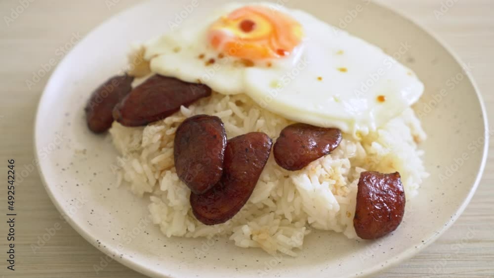 rice with fried egg and Chinese sausage - Homemade food in Asian style rice with fried egg and Chinese sausage - Homemade food in Asian style