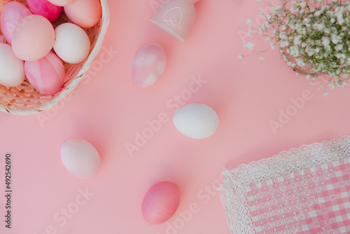 Easter eggs pastel colors on pink background