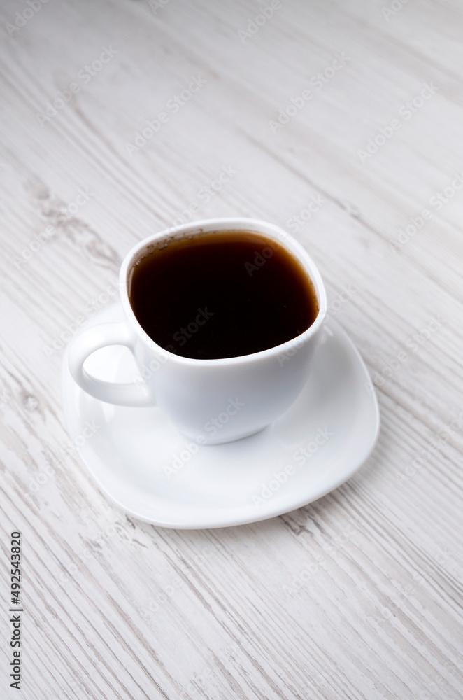 Coffee. White cup of coffee, side view Coffee. White cup of coffee, side view