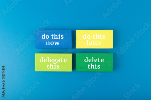 Colorful Eisenhower box concept on dark blue background. Business planning, time management and productivity