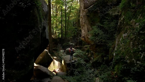 woman hiker with backpack at dovbush rocks canyon photo