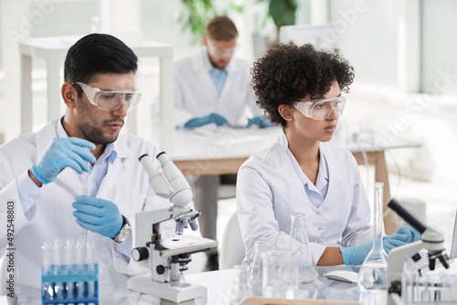 young scientists conduct research in the laboratory.