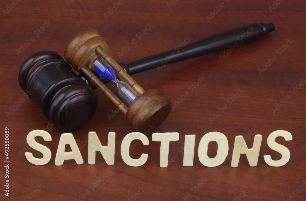 Sanctions time concept with gavel, hourglass and word sanctions. Sanctions time concept with gavel, hourglass and word sanctions.