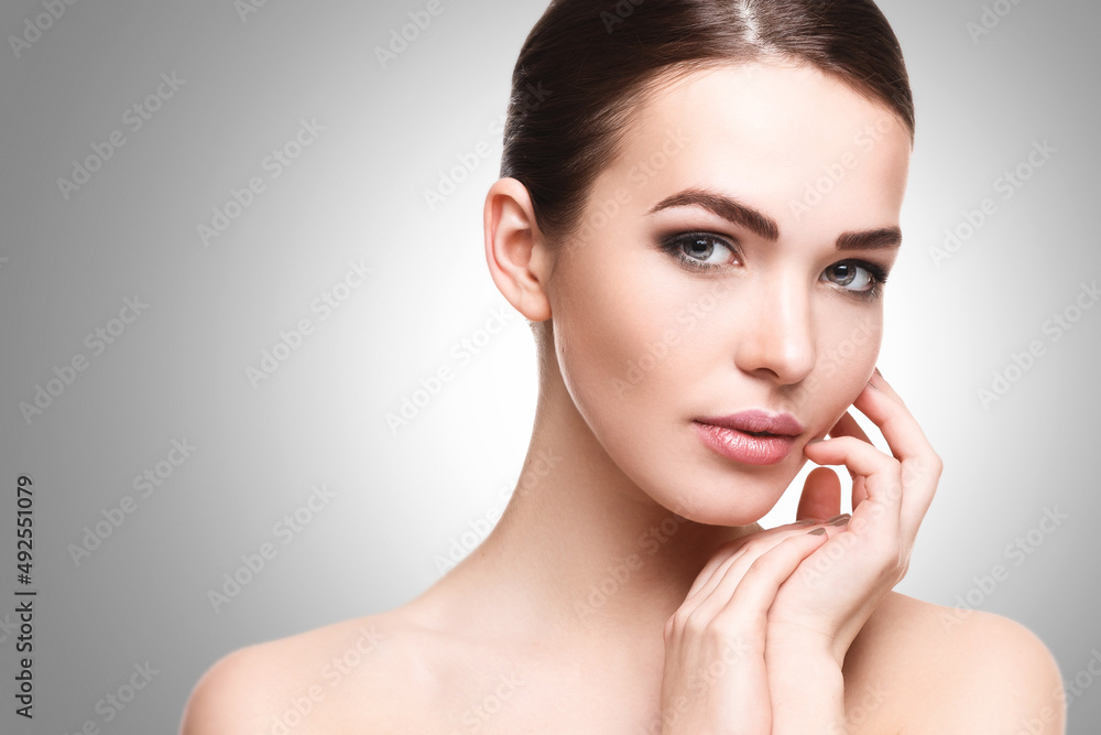 Beautiful young woman with natural makeup and smooth skin Beautiful young woman with natural makeup and smooth skin