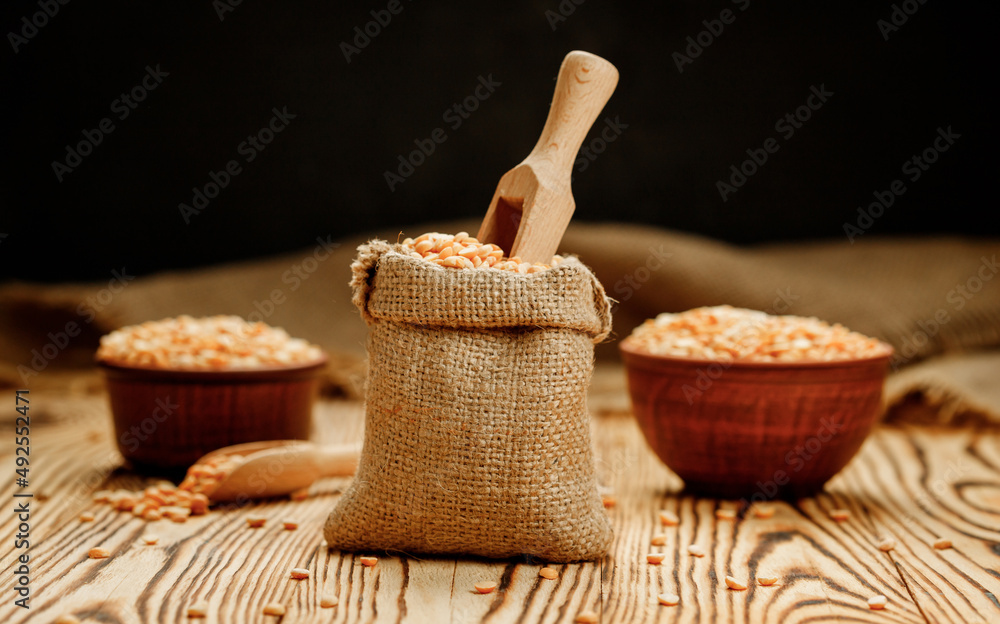 Pea groats in bowls and bags on a wooden background. High quality photo Pea groats in bowls and bags on a wooden background. High quality photo