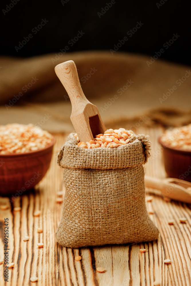 Pea groats in bowls and bags on a wooden background. High quality photo Pea groats in bowls and bags on a wooden background. High quality photo