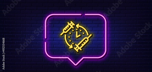 Neon light speech bubble. Vaccination schedule line icon. Vaccine syringe sign. Second injection time symbol. Neon light background. Vaccination schedule glow line. Brick wall banner. Vector