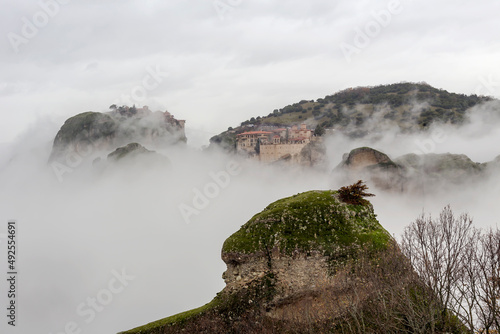 Orthodox monasteries of Meteora (Greece) on the rocks shrouded in fog