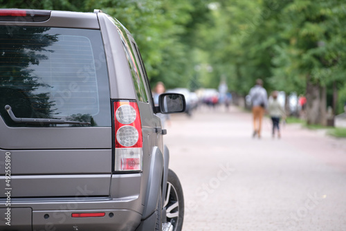 Close up of a car parked on city street side. Urban traffic concept