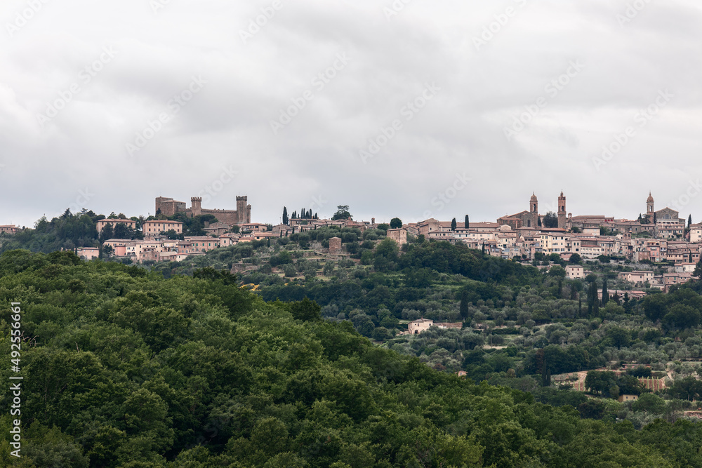 Clear panoramic view over the hilltop of Montalcino medieval town with The Rocca, Fortress and Duomo, Tuscany, Italy