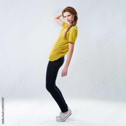 People will stare... Make it worth their while. Full-length studio shot of a beautiful young woman posing in casualwear against a gray background.