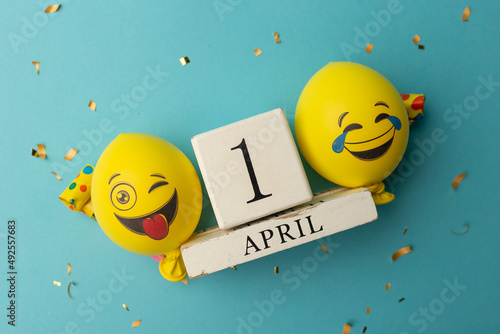 date April 1. Creative concept for April Fools' Day. Festive decor on the blue background photo