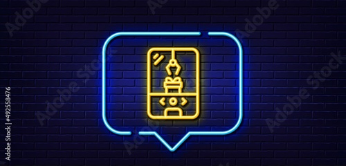 Neon light speech bubble. Crane claw machine line icon. Amusement park sign. Carousels symbol. Neon light background. Crane claw machine glow line. Brick wall banner. Vector