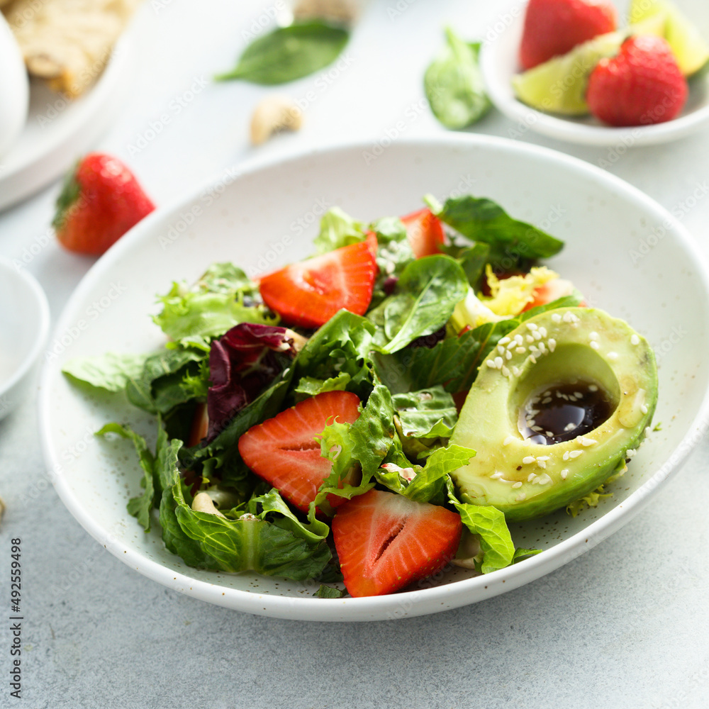 Healthy leaf salad with strawberry and avocado Healthy leaf salad with strawberry and avocado