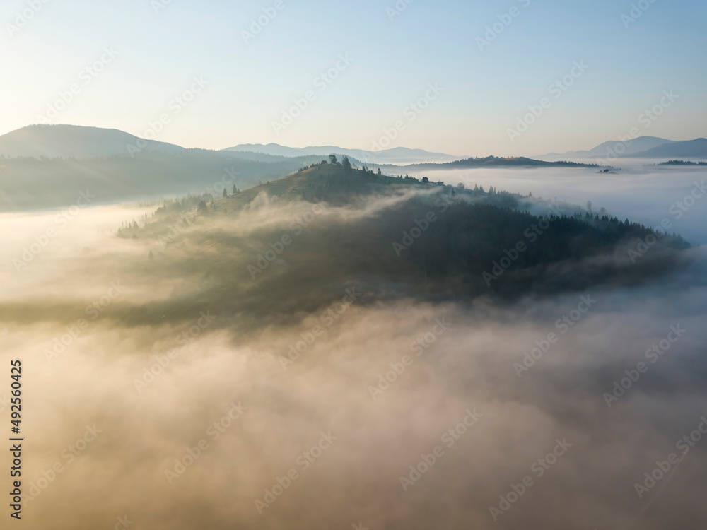 Morning fog in the Ukrainian Carpathians. Aerial drone view. Morning fog in the Ukrainian Carpathians. Aerial drone view.