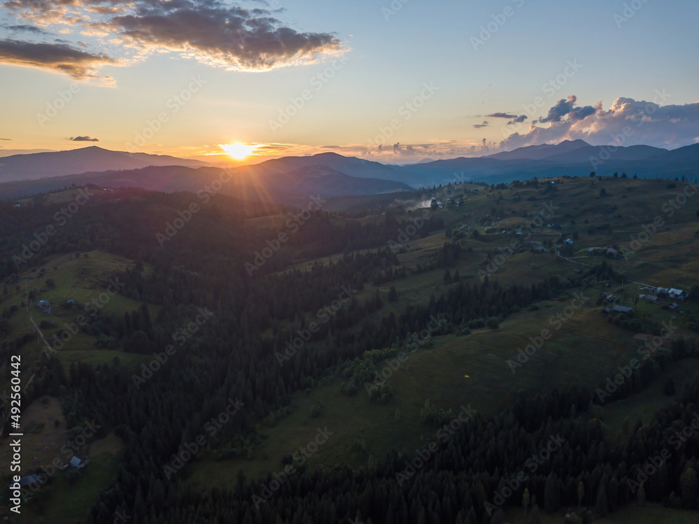 Sunset over the mountains in the Ukrainian Carpathians. Aerial drone view. Sunset over the mountains in the Ukrainian Carpathians. Aerial drone view.
