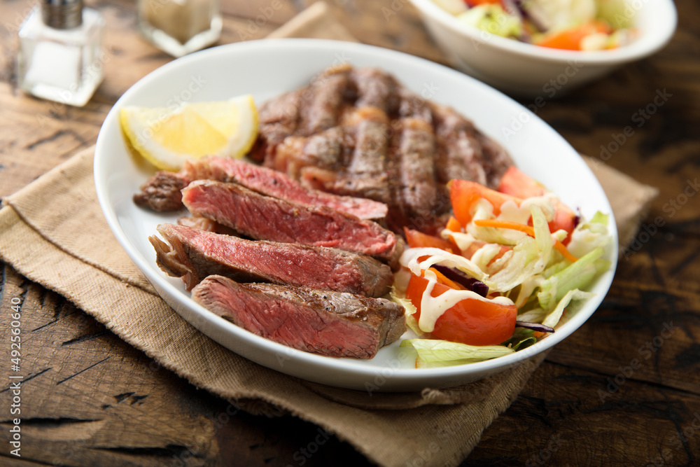 Grilled beef steak with vegetable salad