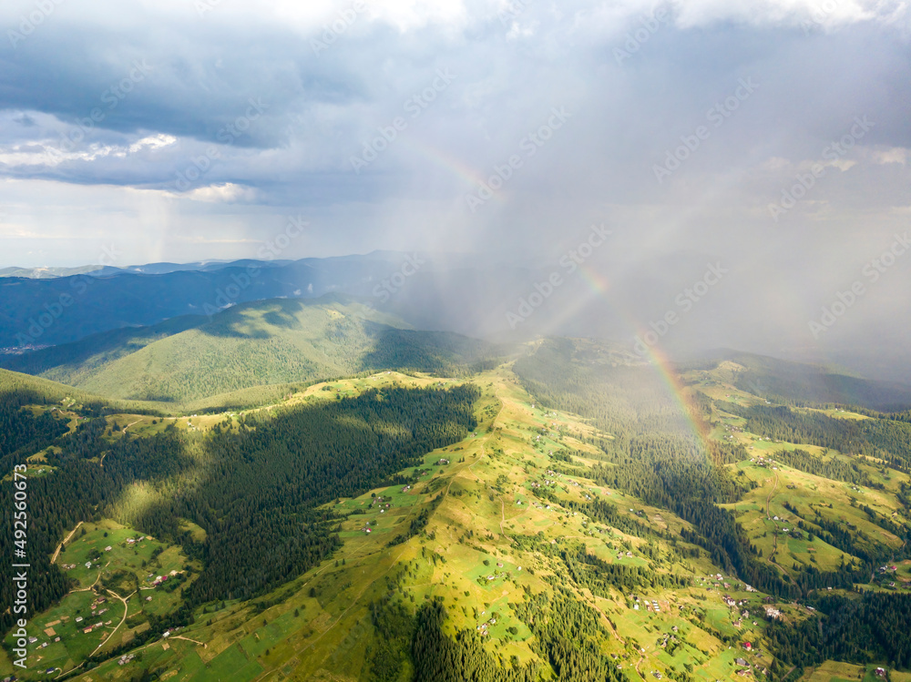 Rainbow in the mountains of the Ukrainian Carpathians. Aerial drone view. Rainbow in the mountains of the Ukrainian Carpathians. Aerial drone view.