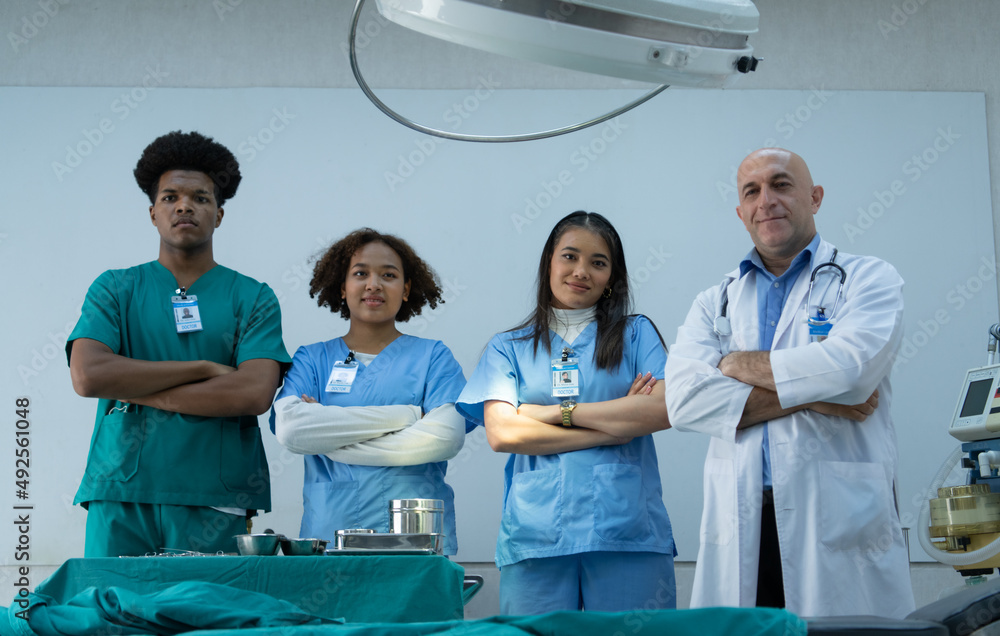 Medical professors and medical students team prepare before teaching surgery Medical professors and medical students team prepare before teaching surgery