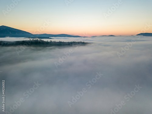 Morning fog in the Ukrainian Carpathians. Aerial drone view.