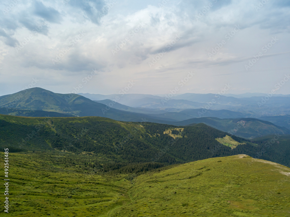 High mountains of the Ukrainian Carpathians in cloudy weather. Aerial drone view. High mountains of the Ukrainian Carpathians in cloudy weather. Aerial drone view.