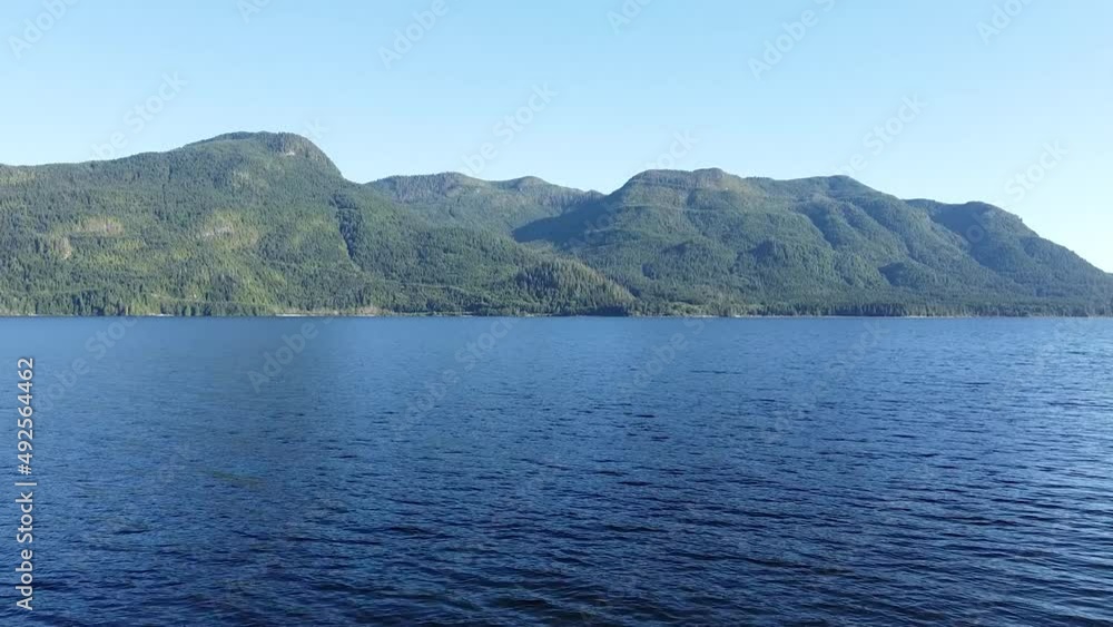 Flying Over Water on West Coast Lake Kennedy Lake, Laylee Island, Vancouver Island, Canada Flying Over Water on West Coast Lake Kennedy Lake, Laylee Island, Vancouver Island, Canada