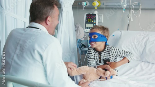 Doctor visit superhero child at hospital