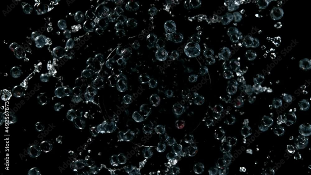 Super slow motion of rotating blueberries with splashing water, top view. Filmed on high speed cinema camera, 1000 fps. Speed ramp effect. Super slow motion of rotating blueberries with splashing water, top view. Filmed on high speed cinema camera, 1000 fps. Speed ramp effect.