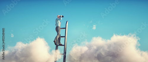 Man on top of a ladder looks through binoculars in the clouds.