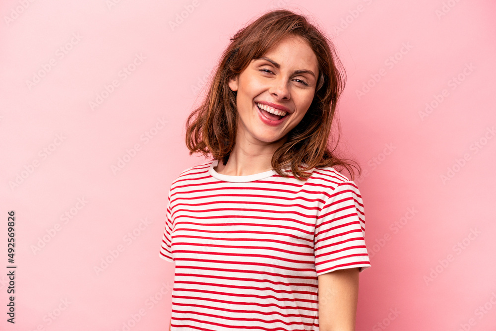 Young caucasian woman isolated on pink background confident keeping hands on hips. Young caucasian woman isolated on pink background confident keeping hands on hips.