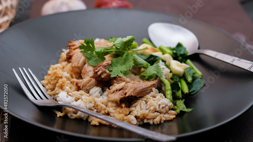 Stewed pork leg on rice, Thai food and street food that Thai people like to eat. or what we call " Khao kha moo "