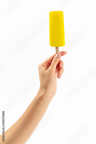 girl holding ice cream stick