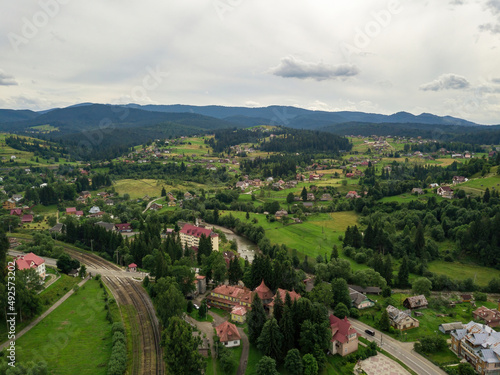 Settlement in the mountains of the Ukrainian Carpathians. Aerial drone view.