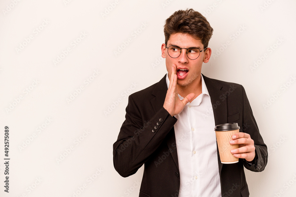 Young caucasian business man holding takeaway coffee isolated on white background is saying a secret hot braking news and looking aside Young caucasian business man holding takeaway coffee isolated on white background is saying a secret hot braking news and looking aside