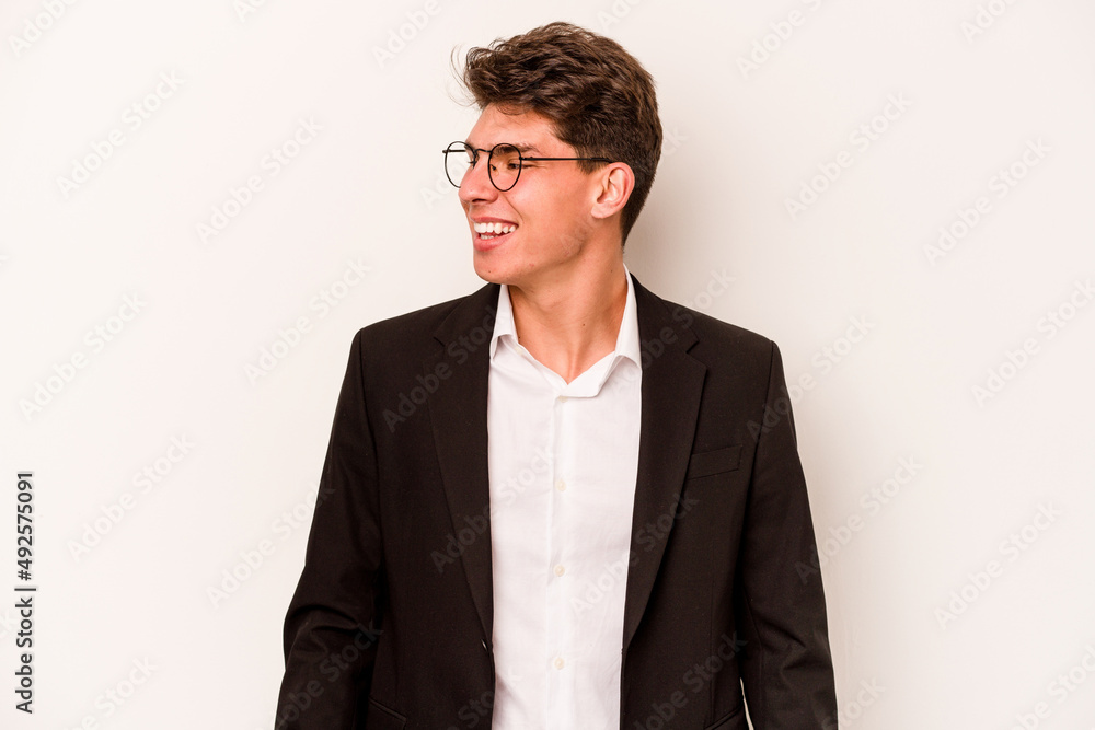Young caucasian business man isolated on white background looks aside smiling, cheerful and pleasant. Young caucasian business man isolated on white background looks aside smiling, cheerful and pleasant.