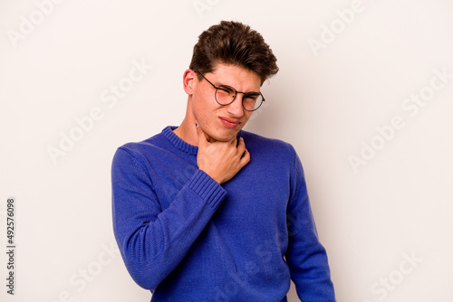 Obraz na plátně Young caucasian man isolated on white background suffers pain in throat due a virus or infection