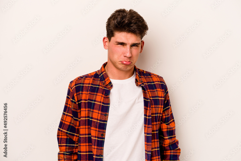 Young caucasian man isolated on white background sad, serious face, feeling miserable and displeased. Young caucasian man isolated on white background sad, serious face, feeling miserable and displeased.