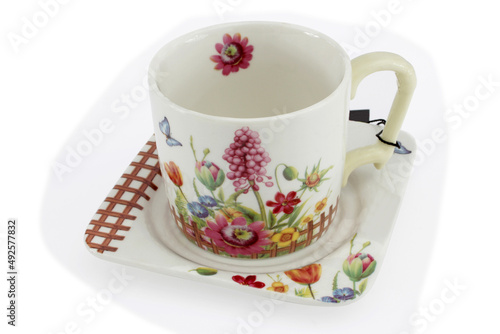  Porcelain mug with a floral pattern.