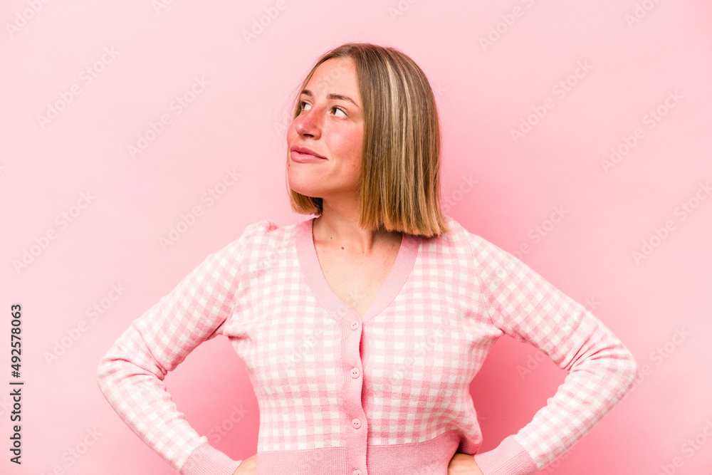 Young caucasian woman isolated on pink background dreaming of achieving goals and purposes Young caucasian woman isolated on pink background dreaming of achieving goals and purposes
