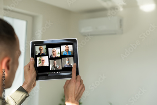 Closeup of a woman talking through video chat on tablet. communicating tablet in video chat through webcam.