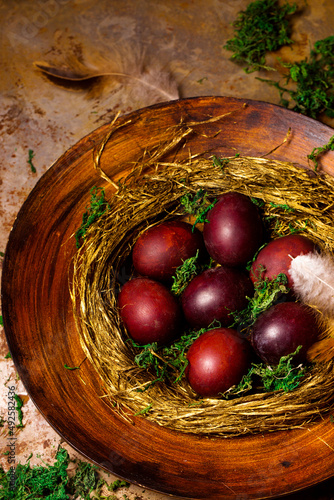 Beautiful red Easter eggs in a nest
