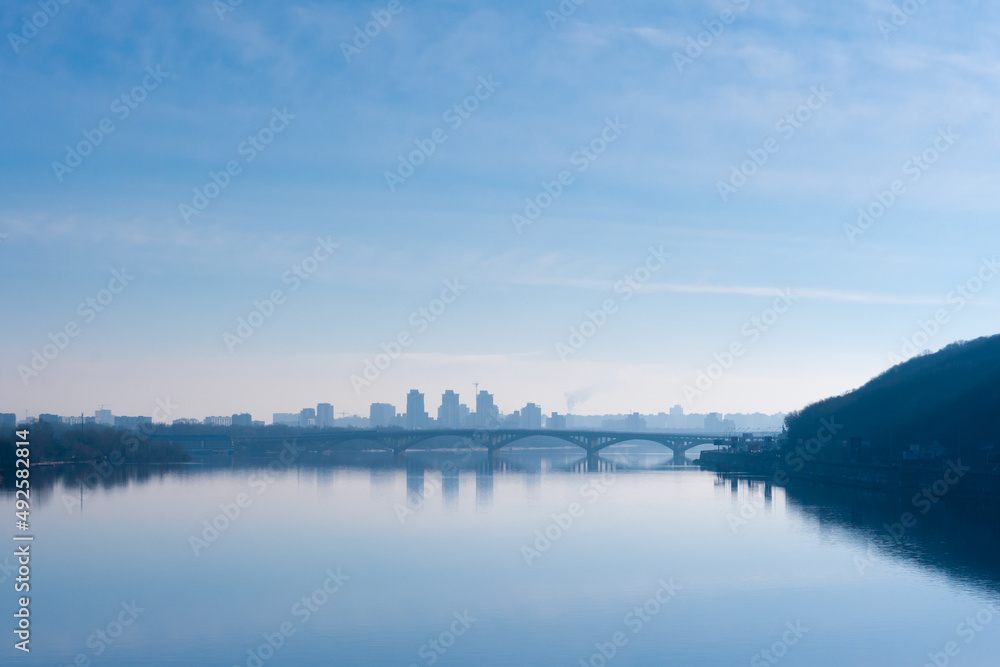 Evening city landscape of the capital of Ukraine from the bridge on Dnipro river