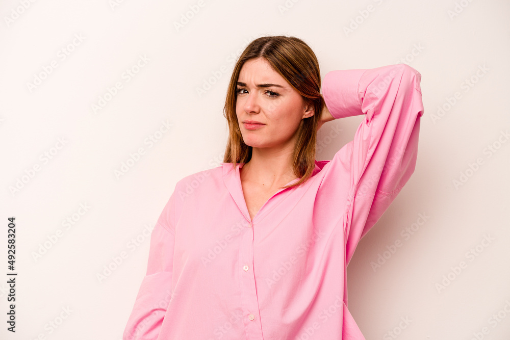 Obraz premium Young caucasian woman isolated on white background tired and very sleepy keeping hand on head.
