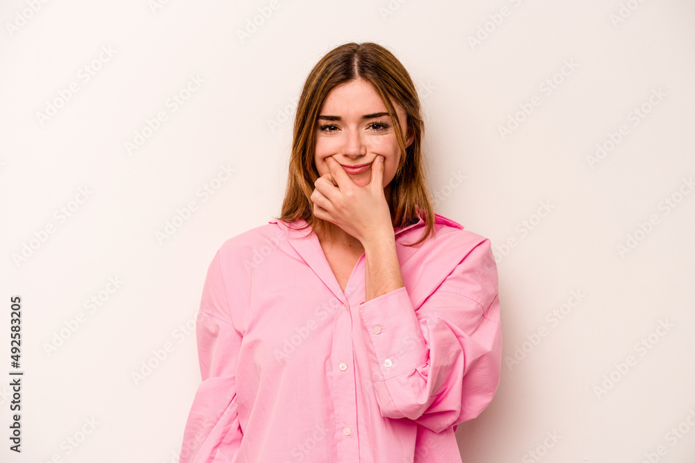 Young caucasian woman isolated on white background doubting between two options. Young caucasian woman isolated on white background doubting between two options.