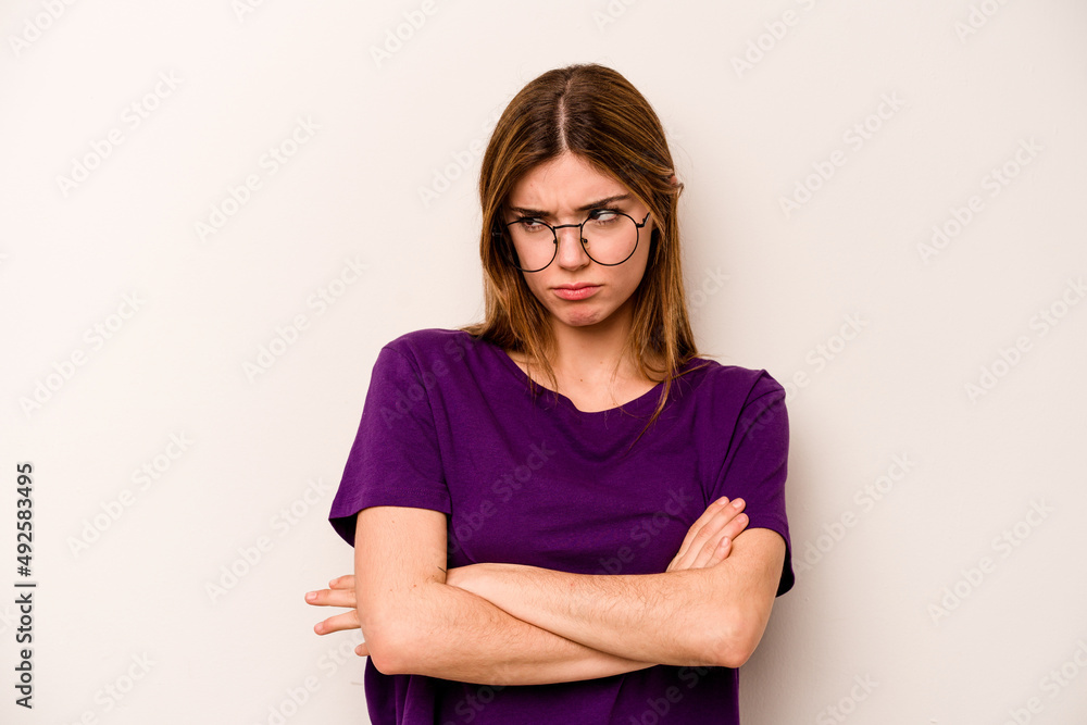 Fototapeta premium Young caucasian woman isolated on white background tired of a repetitive task.