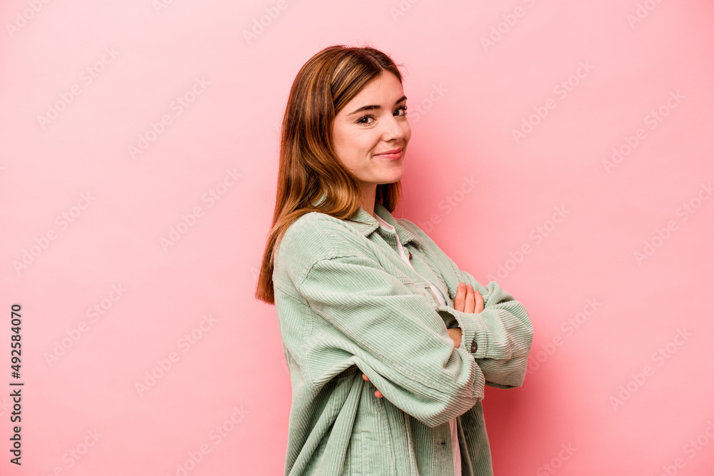 Young caucasian woman isolated on pink background happy, smiling and cheerful. Young caucasian woman isolated on pink background happy, smiling and cheerful.
