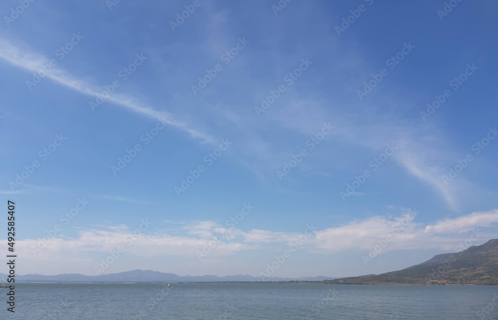 clouds over the lake. Lam Ta Khong Dam. blue sky over the lake.